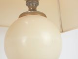 a lamp that is hanging from the ceiling in the room