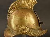helmet of a roman soldier with a golden helmet on a black background