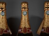 three bottles of champagne that are sitting on a table