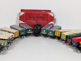 several toy trains are lined up in a circle on a white surface