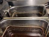 three deep fryers that are sitting in the oven