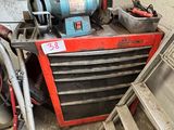 a red tool box with tools on it next to a pile of other tools