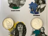 four different coins with pictures of people on them in a box