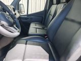 the interior of a car with a steering wheel and leather seats