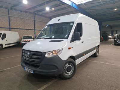 the white van is parked in a large warehouse with other vehicles