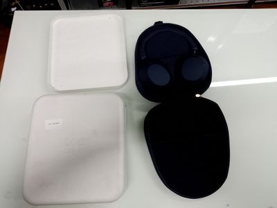 a white box with a black lid and a white box with a black lid