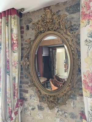 a mirror hanging on the wall in a living room