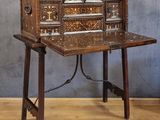 a wooden desk with a drawer on top of it