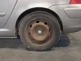 a close up of a flat tire on a car