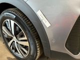 a close up of a car tire with a sticker on it