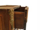 a wooden cabinet with a drawer on top of it
