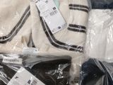 a lot of clothes that are wrapped in plastic bags
