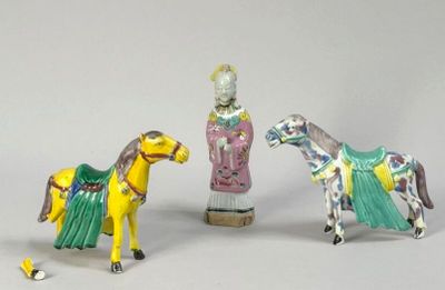 three figurines of a horse and a man on a horse