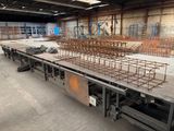 a large room with a lot of steel bars on the floor