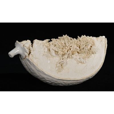 a white bowl with a handle on a black background