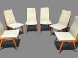 six chairs in the shape of a circle on a gray background