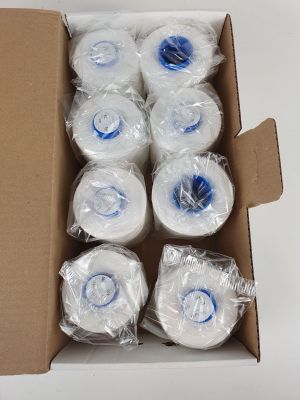 six rolls of toilet paper wrapped in plastic wrap