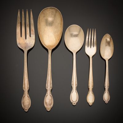 six antique silverware pieces including a fork, spoon, and spoon rest