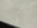 a close up of a piece of paper with a logo on it