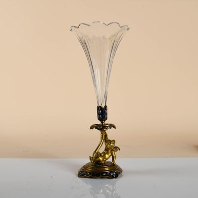 a glass vase that is sitting on a table