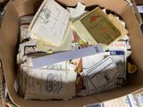 a cardboard box filled with many different types of mail
