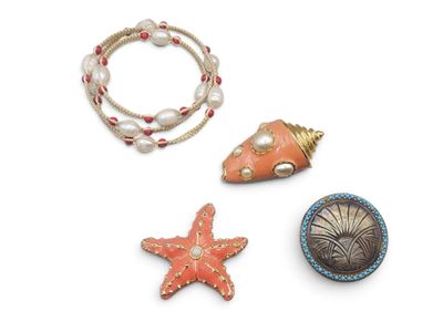 three pieces of jewelry that are on a white surface