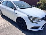 a picture of a white car parked on the side of the road