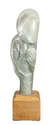 statue of a woman holding a baby elephant on a wooden base
