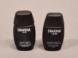 two black salt and pepper shakers sitting on top of a table