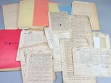 a pile of old papers on a blue table