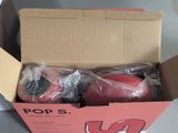 a cardboard box with a pair of shoes inside of it