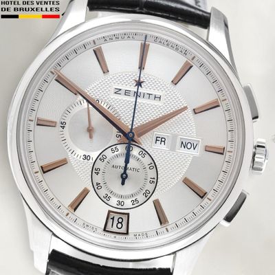 a close up of a wrist watch with a white dial