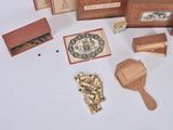 a lot of small wooden items that are on the table