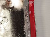 a close up of a metal object with a cat in it