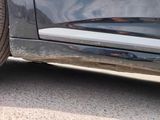 a close up of a car ' s rear end with mud on it