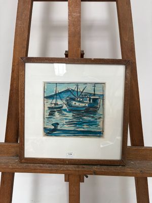 une photo d'une photo représentant un bateau dans l'eau, posée sur un chevalet