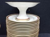 many plates stacked on top of each other on a table
