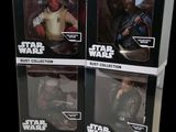three star wars action figures sit in boxes on a black background