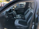 the interior of a car with two seats and a steering wheel