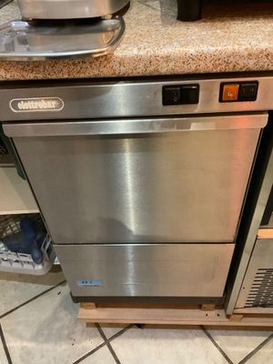 a stainless steel dishwasher and a microwave in a kitchen