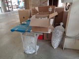 a table with boxes and bags on it in a warehouse