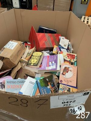 a cardboard box full of books in a store