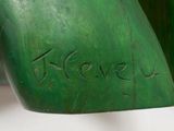 a close up of a green vase with a name written on it