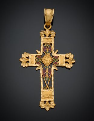 une croix dorée ornée d'un motif floral sur fond noir