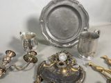 a lot of silver items that are on a table