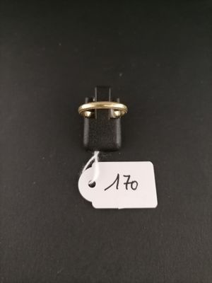 a close up of a small black object with a tag attached to it