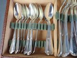 a lot of spoons and spoon spoons in a box