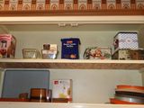 a cabinet with a lot of food on it