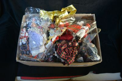 a box full of assorted items sitting on a chair