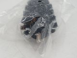 a cell phone wrapped in a plastic bag on a table